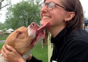 Dog kissing woman